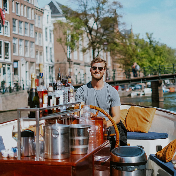 People enjoying the amsterdam light festival from a boat