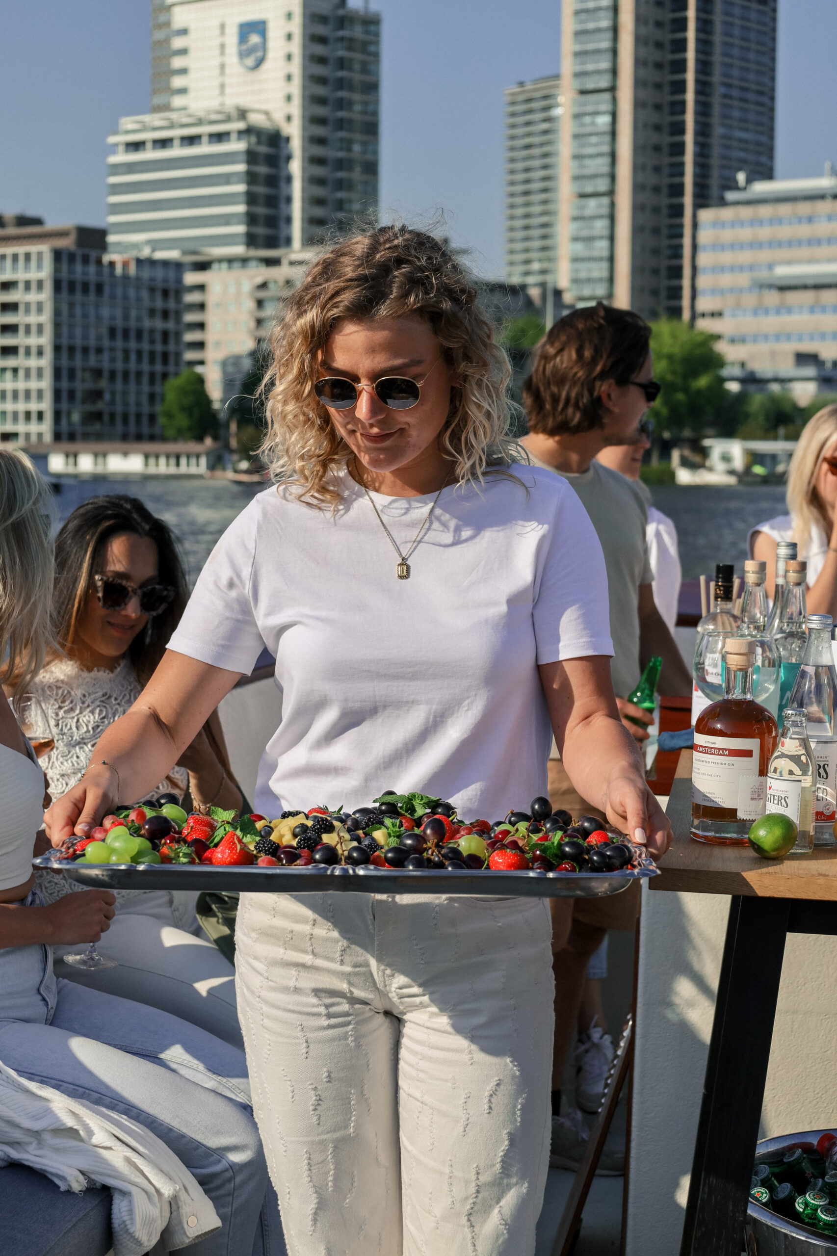 Customers enjoying a Boat tour with food and beverages